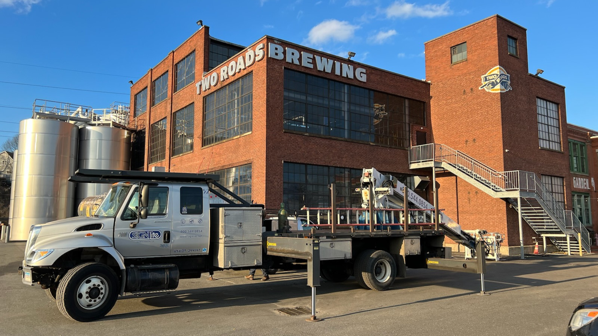 Custom Signage On Big Brown Building